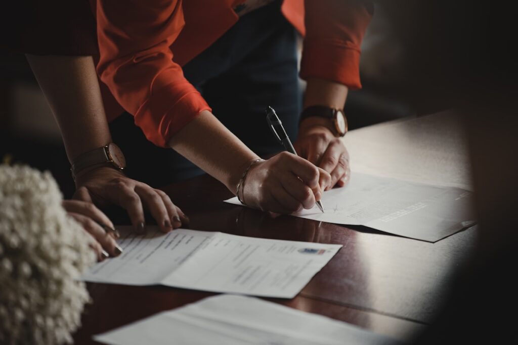 Executor signing probate and estate documents to sell an inherited Long Island house