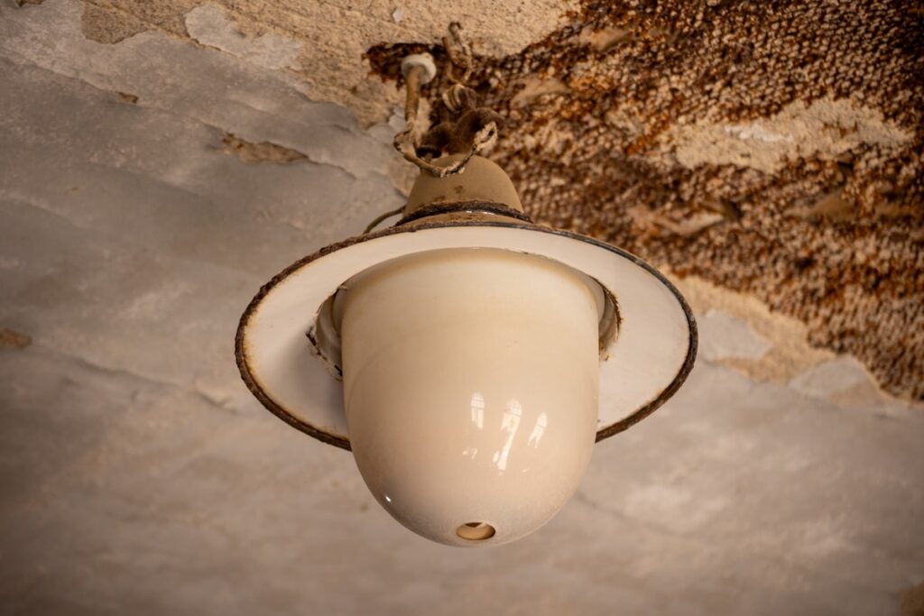 Water stains spreading across the ceiling of a water damaged Long Island house