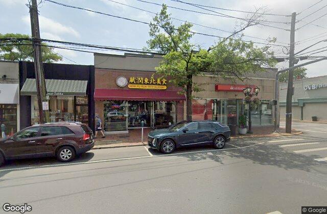 Street view of Middle Neck Road village center in Great Neck NY where EZ Home Buyers pays cash for houses