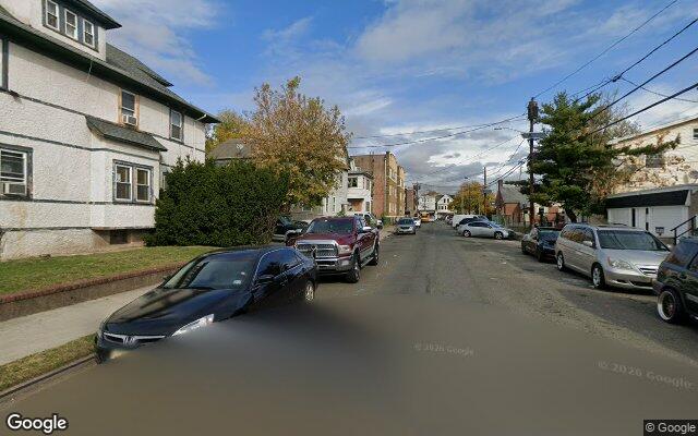 Residential street of older frame houses in Paterson, NJ