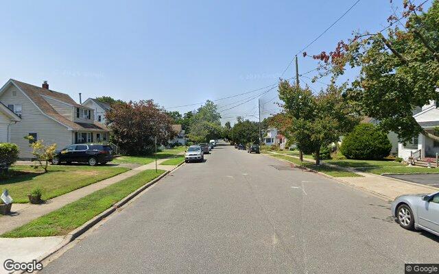 Residential street of single family homes in Hicksville, NY