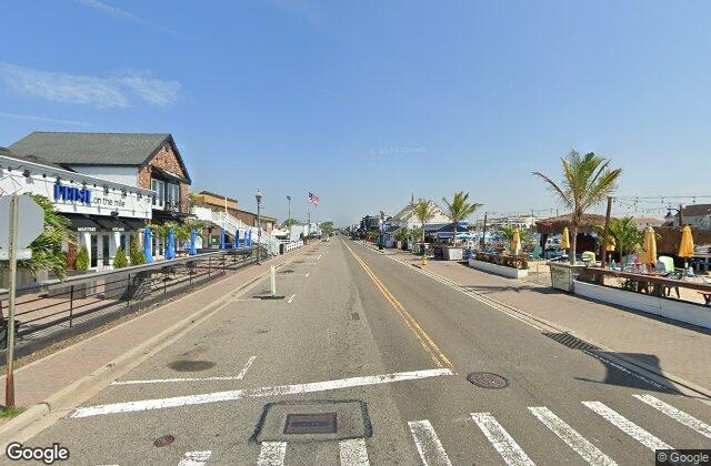Street view of the Nautical Mile on Woodcleft Avenue in Freeport NY where EZ Home Buyers pays cash for houses