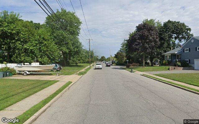 Postwar capes and splits on a residential street in East Meadow, NY