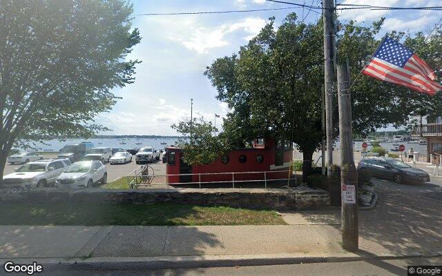 Port Washington town dock with the harbor and moored boats in Port Washington NY