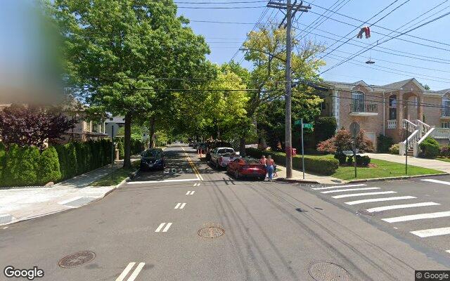 Detached homes on a tree lined residential street in Whitestone, Queens NY