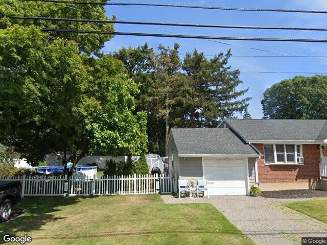 We buy houses in Bethpage, NY A brick ranch with an attached garage on South 1st Street in Bethpage
