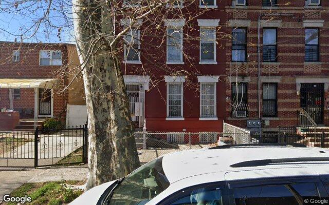 Attached brick two family houses on Hendrix Street in East New York, Brooklyn