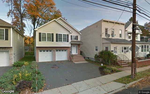 A new colonial beside an older frame house on Conant Street in Hillside, NJ