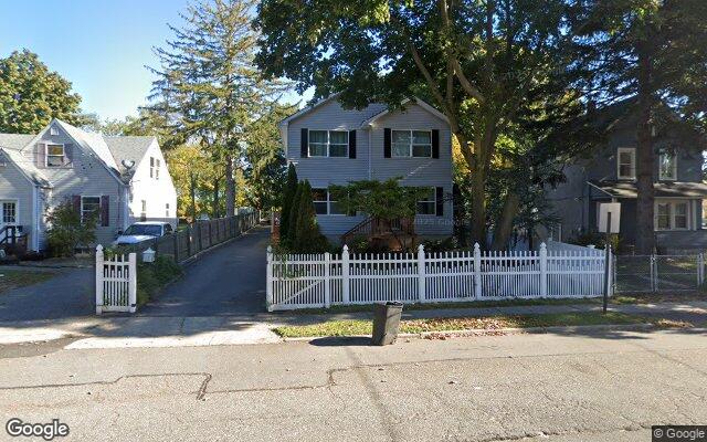 A colonial with a picket fence on Lowndes Avenue in Huntington Station