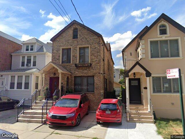 A brick detached two family on Saunders Street in Rego Park