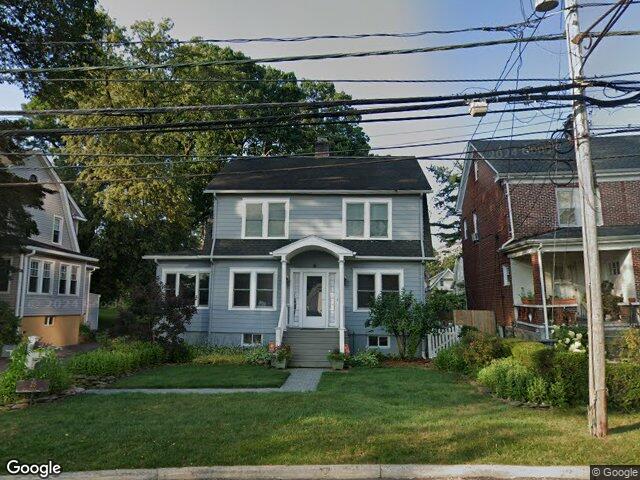 A colonial with a portico entrance on Hillandale Avenue in Stamford