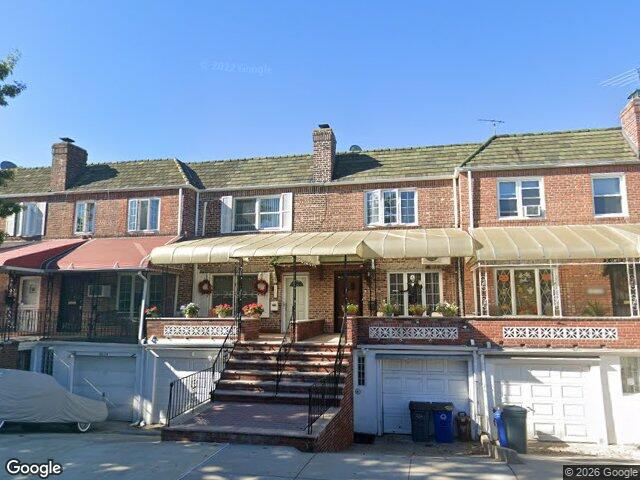 We buy houses in Middle Village, NY Attached brick rows with awnings on a side street in Middle Village, Queens, built in the 1930s and held by the same families for decades
